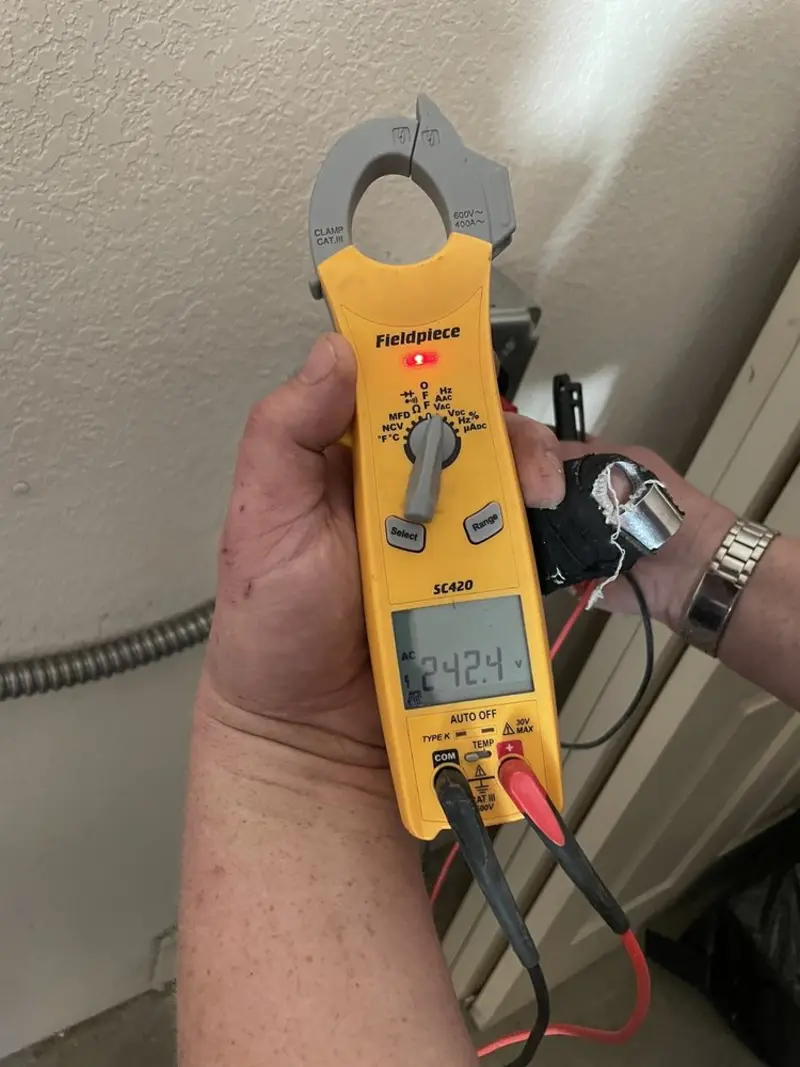 Voltage testing with clamp meter during Ceiling Fan Installation in Wilson
